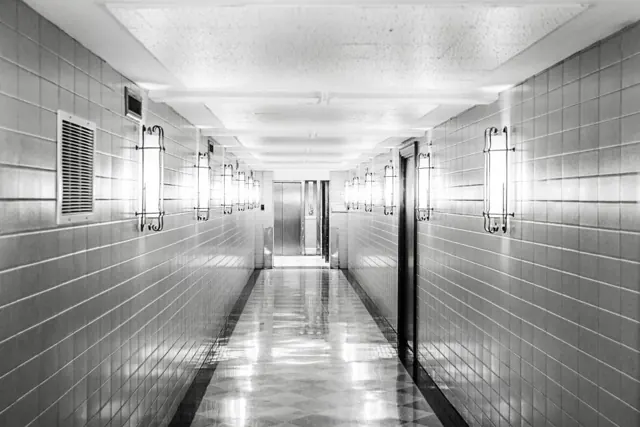 Long corridor with tiled walls and floor
